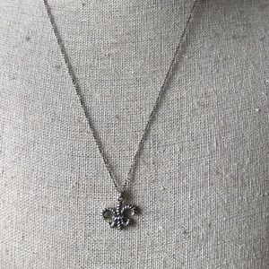 Waxing Poetic silver tone necklace with Fleur de lis charm